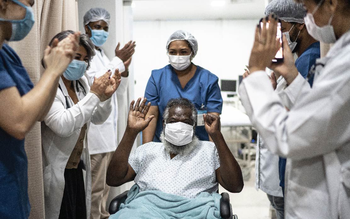 Healthcare staff and patient are happy and celebrating